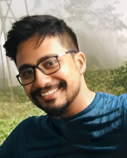 Portrait of Srijan Roy Sir, smiling